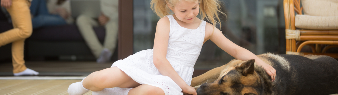 Image of little girl with dog.
